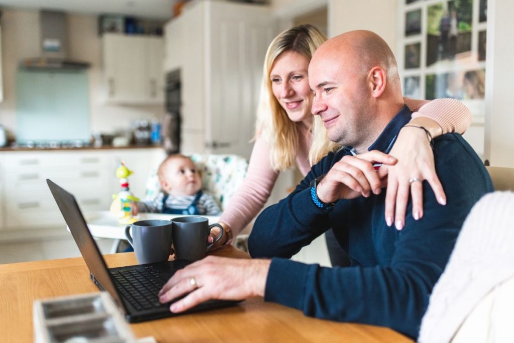 Solar Panels – Everything you need to know. Image of couple viewing laptop screen.